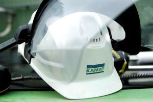Kamat hardhat sitting on a green table